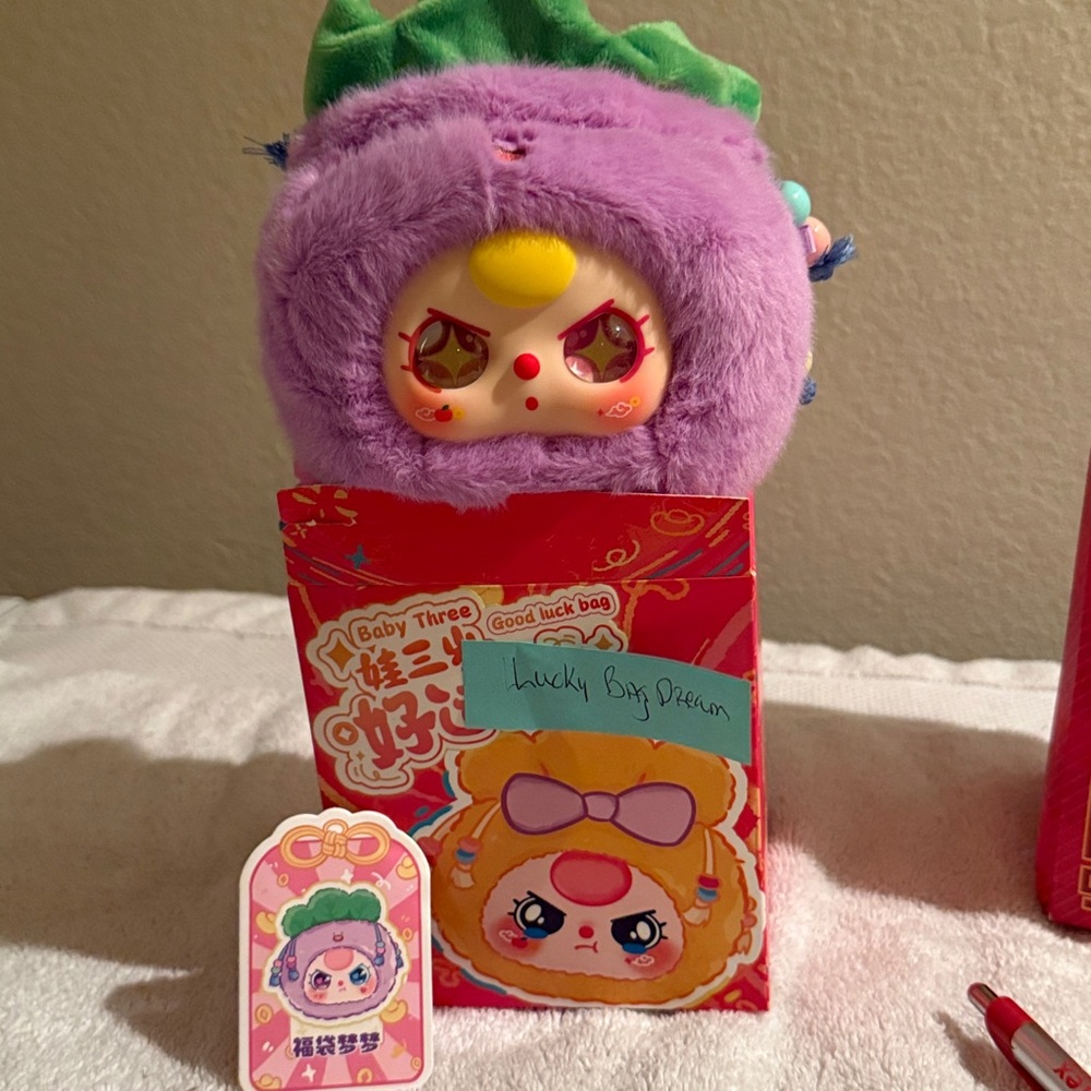 Purple Plush Toy with Red and Yellow Accents